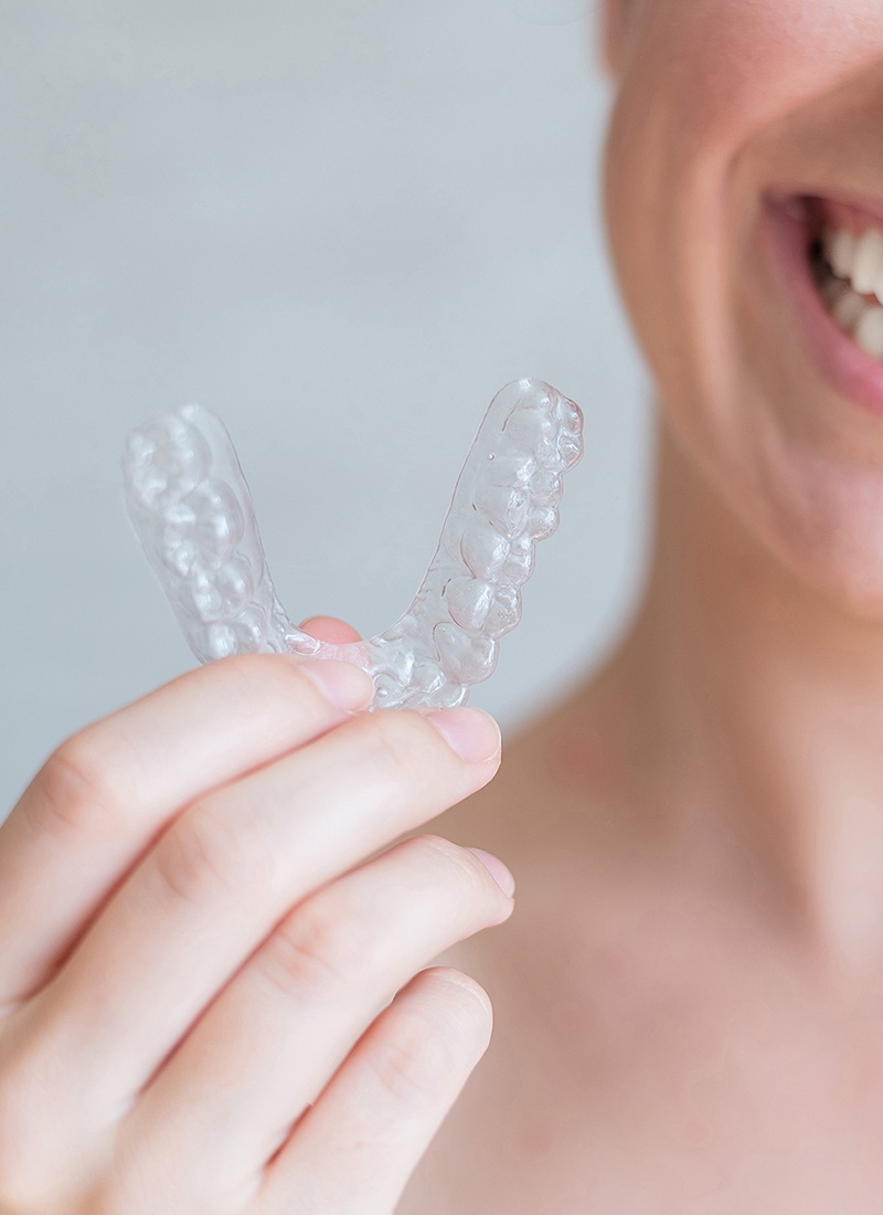 Close-up,Of,Orthodontic,Silicone,Transparent,Teeth,Aligner,In,Female,Hands.